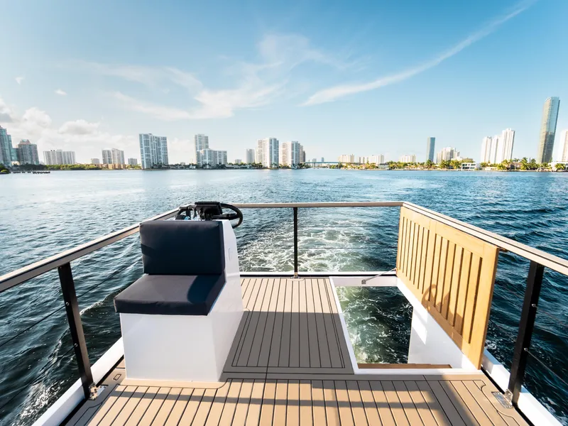 Slide: The Image of Modern 2024 Navisyo Homes 28' NAVIS V.08 boat on scenic waterfront. - 30