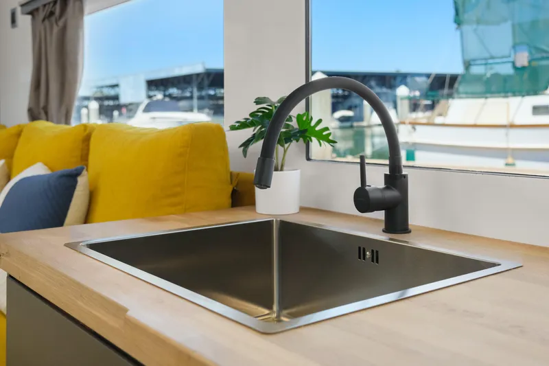 Slide: The Image of Modern kitchen sink in 2024 Navisyo Homes 28' NAVIS V.08 houseboat interior. - 36