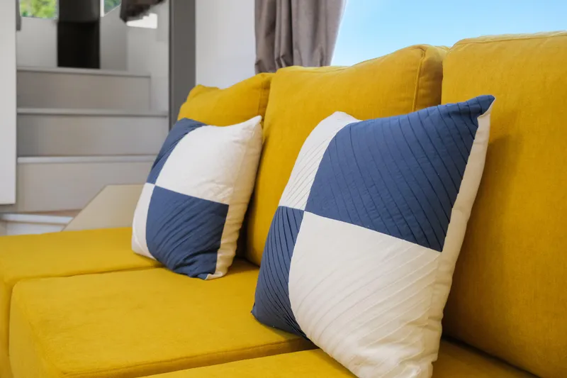 Slide: The Image of Yellow sofa with blue and white pillows in 2024 Navisyo Homes 28' NAVIS V.08. - 37