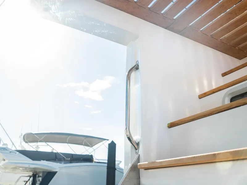 Slide: The Image of Staircase on 2024 Navisyo Homes 28' NAVIS V.08 yacht, with sunlight and boat in background. - 20