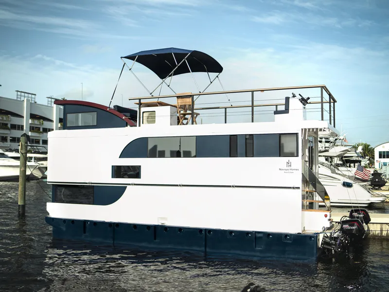 Slide: The Image of 2024 Navisyo Homes 28' NAVIS V.08 houseboat docked in marina. - 31