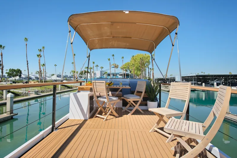 Slide: The Image of Luxurious 2024 Navisyo Homes 28' NAVIS V.08 yacht deck with seating and canopy. - 5