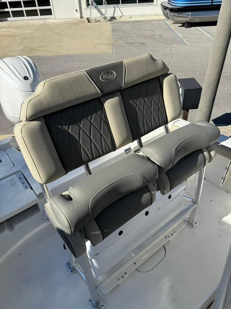 Slide: The Image of 2025 Key West 210 Bay Reef boat seating with cushioned backrest and armrests. - 6