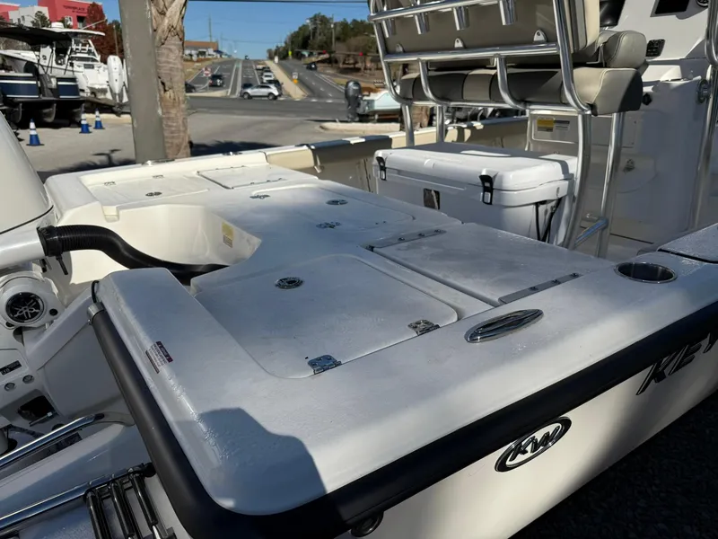 Slide: The Image of 2025 Key West 210 Bay Reef boat with seating and storage compartments. - 7