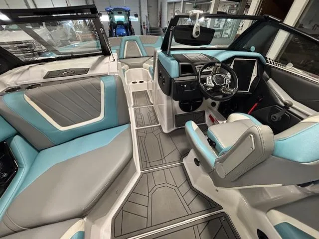 Slide: The Image of 2020 Tigé 20RZX boat interior with modern design and blue-gray seating. - 12