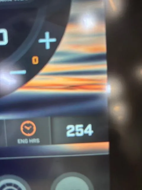 Slide: The Image of Close-up of Tigé 20RZX 2020 dashboard showing 254 engine hours. - 20