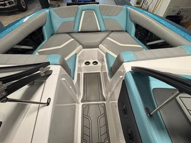 Slide: The Image of 2020 Tigé 20RZX boat interior with gray and teal seating, modern design. - 27
