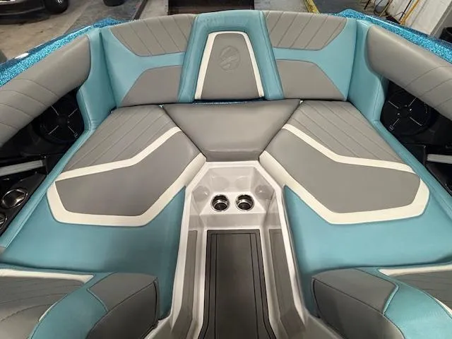 Slide: The Image of 2020 Tigé 20RZX boat interior with blue and gray seating. - 28