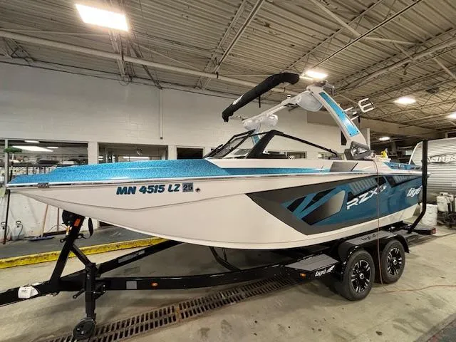 Slide: The Image of 2020 Tigé 20RZX boat on trailer in indoor facility. - 3