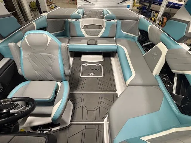 Slide: The Image of 2020 Tigé 20RZX boat interior with gray and teal seating, modern design. - 31