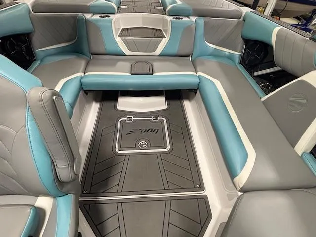 Slide: The Image of 2020 Tigé 20RZX boat interior with gray and teal seating, modern design. - 33