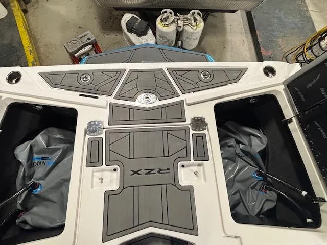 Slide: The Image of 2020 Tigé 20RZX boat interior with storage compartments and sleek design. - 37