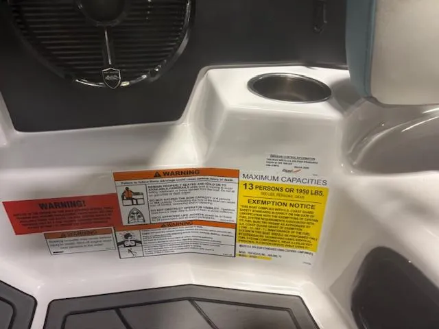 Slide: The Image of Warning labels and capacity notice on 2020 Tigé 20RZX boat interior. - 38
