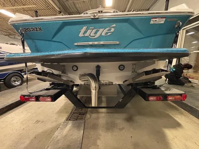 Slide: The Image of 2020 Tigé 20RZX boat rear view in a garage setting. - 4