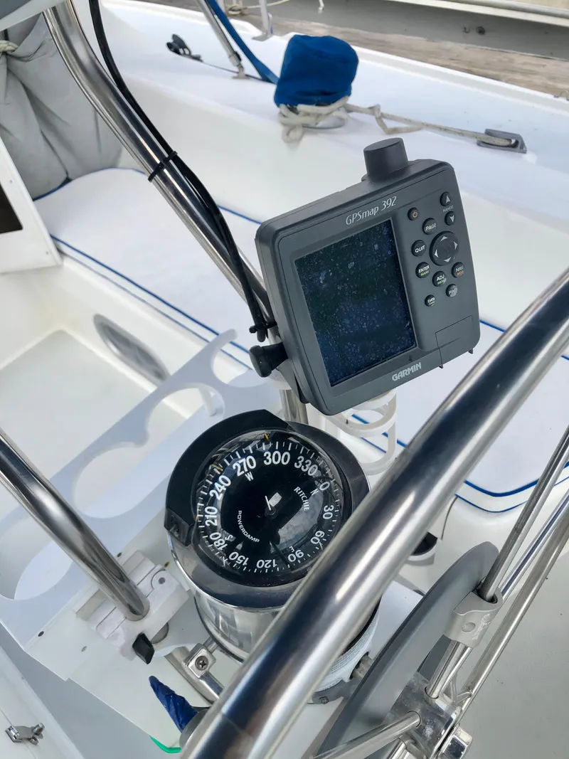 Slide: The Image of Compass and GPS on a 2000 Catalina 320 sailboat cockpit. - 23