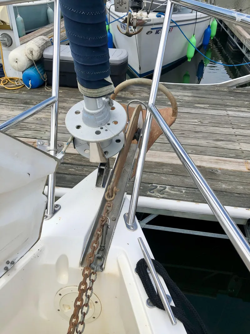 Slide: The Image of Bow of a 2000 Catalina 320 sailboat with anchor and chain at dock. - 26