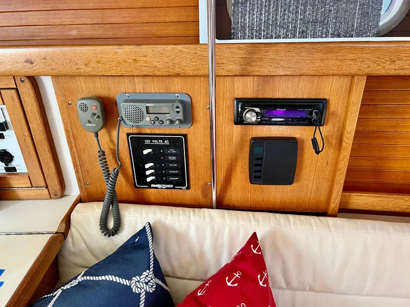 Slide: The Image of Interior of a 2000 Catalina 320 sailboat with radio and control panel. - 47