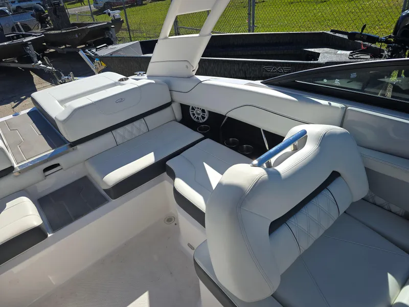 Slide: The Image of 2021 Regal LS2 boat interior with white seating and modern design. - 12