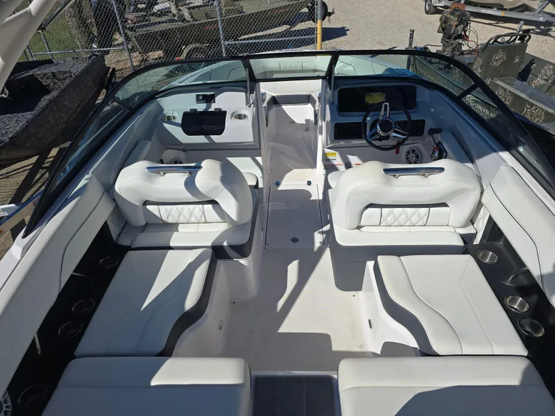 Slide: The Image of 2021 Regal LS2 boat interior with white seating and modern dashboard. - 13