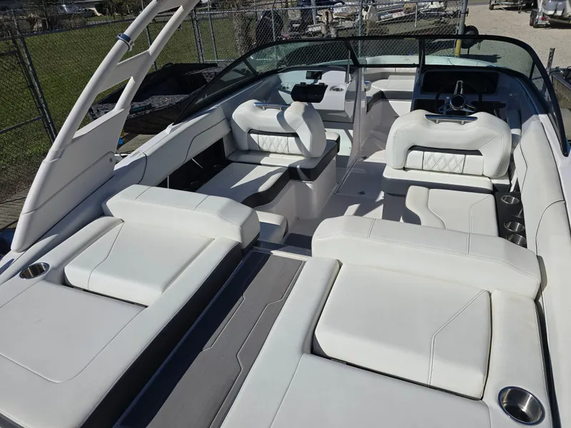 Slide: The Image of 2021 Regal LS2 boat interior with white seating and modern design. - 16
