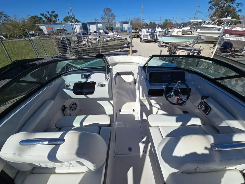 Slide: The Image of 2021 Regal LS2 boat interior with white seating and modern dashboard. - 3