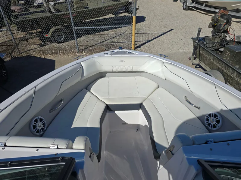 Slide: The Image of 2021 Regal LS2 boat interior with white seating and speakers. - 4