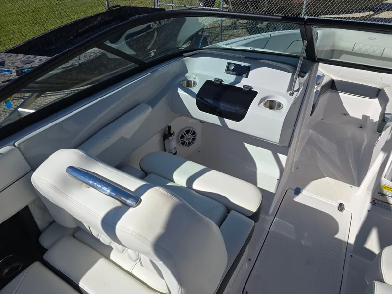 Slide: The Image of 2021 Regal LS2 boat interior with white seating and modern dashboard. - 8