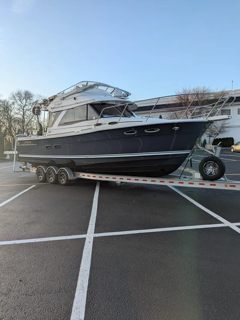 Slide: The Image of 2022 Cutwater C-32 CB boat on trailer in parking lot. - 10