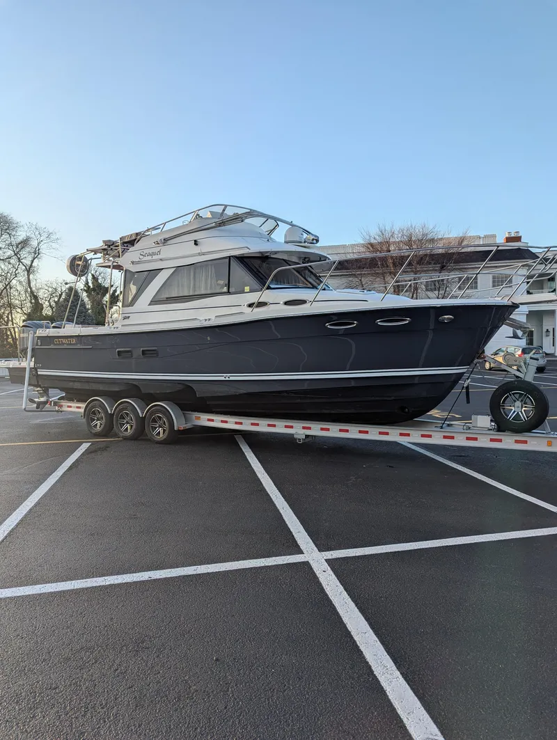 Slide: The Image of 2022 Cutwater C-32 CB boat on trailer in parking lot. - 11