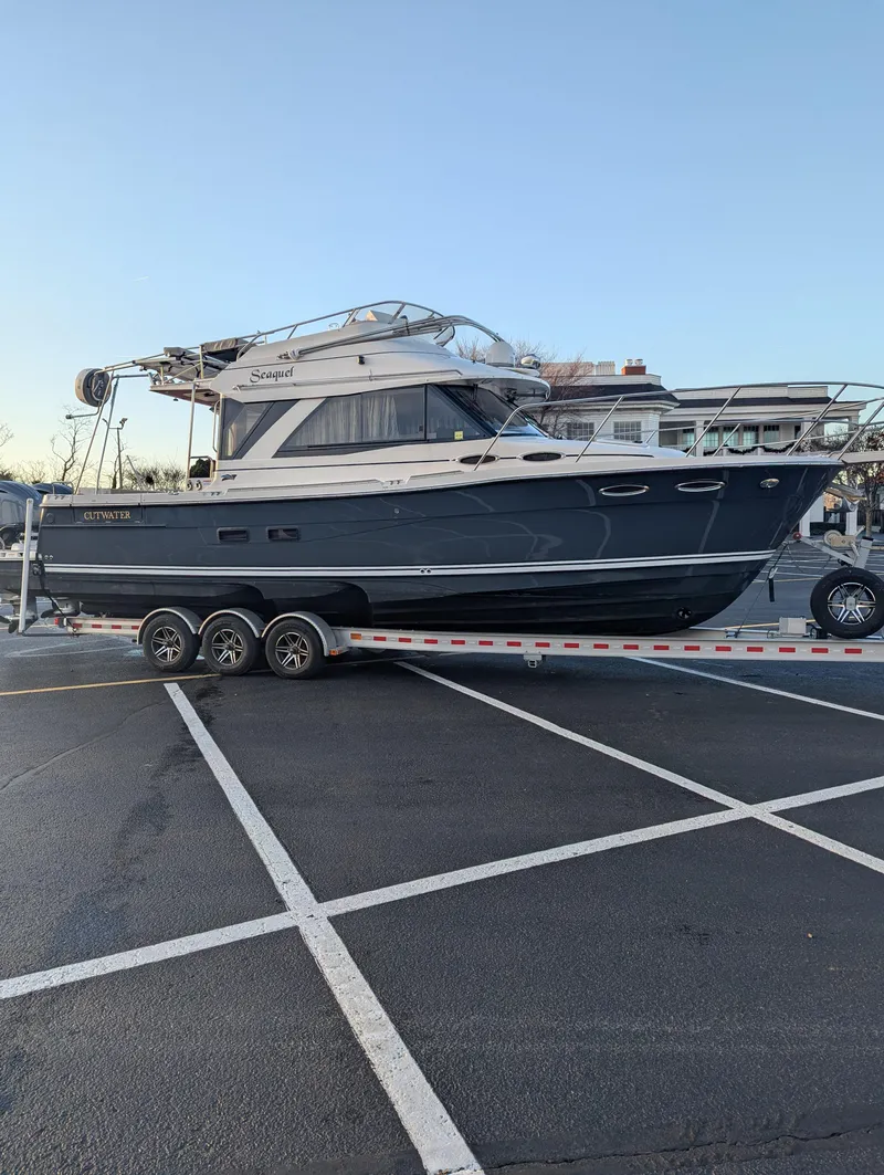 Slide: The Image of 2022 Cutwater C-32 CB boat on trailer in parking lot. - 12