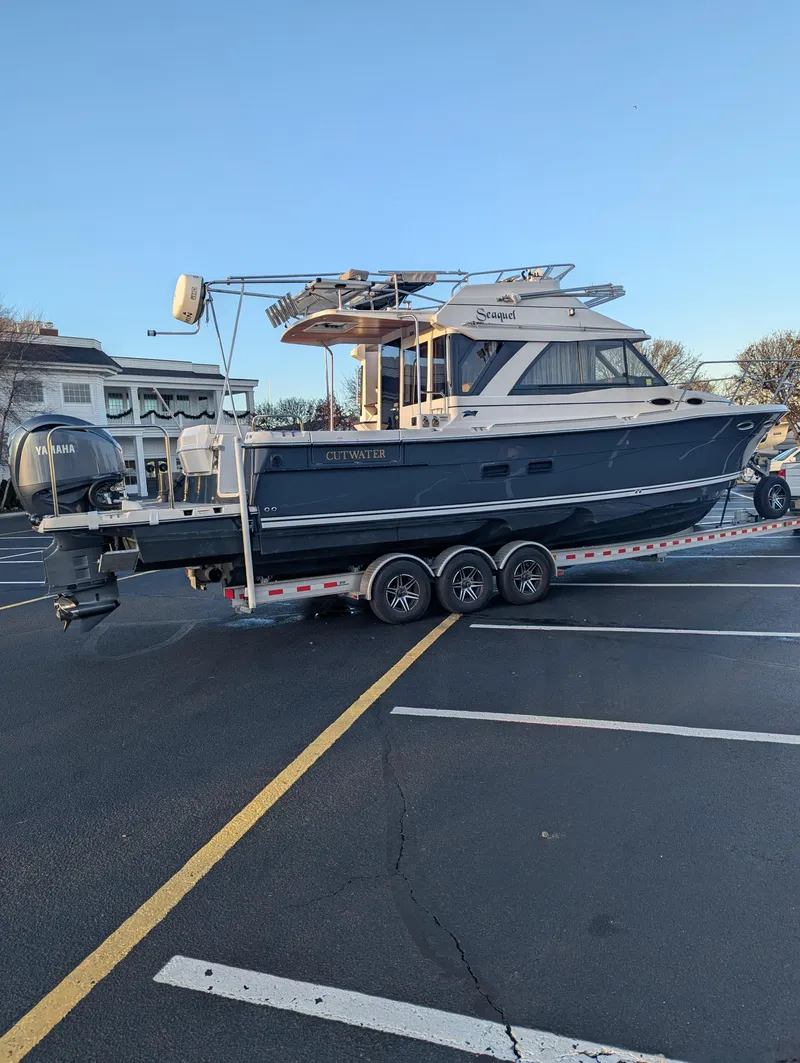 Slide: The Image of 2022 Cutwater C-32 CB boat on trailer in parking lot. - 13