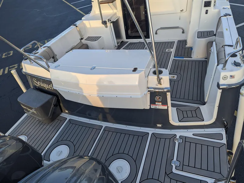 Slide: The Image of 2022 Cutwater C-32 CB boat deck with seating and storage compartments. - 15