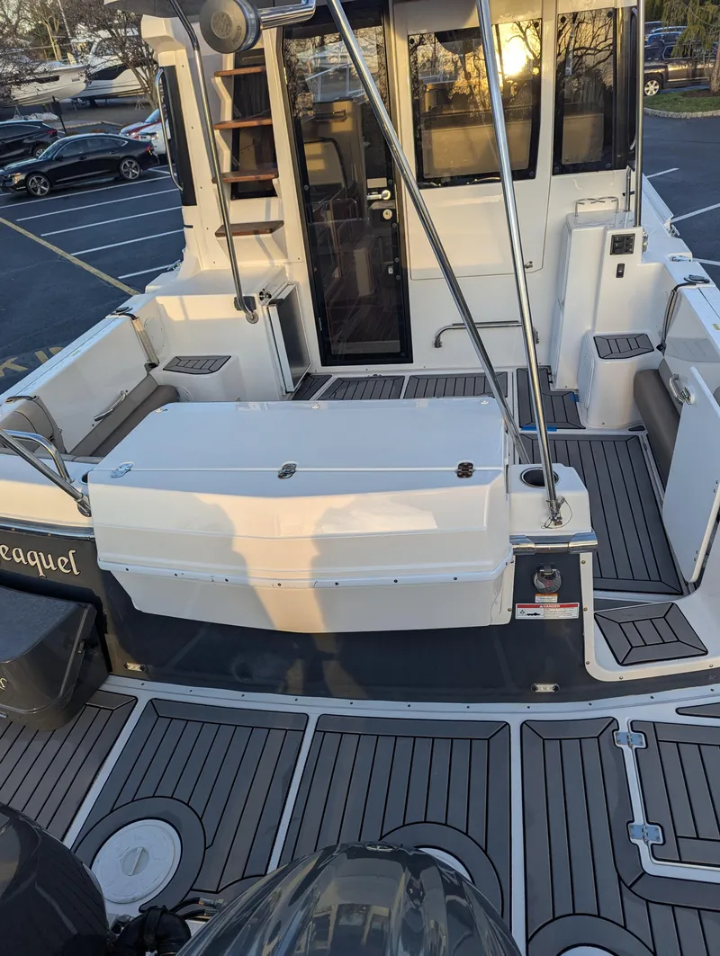 Slide: The Image of 2022 Cutwater C-32 CB boat with spacious deck and modern design. - 16