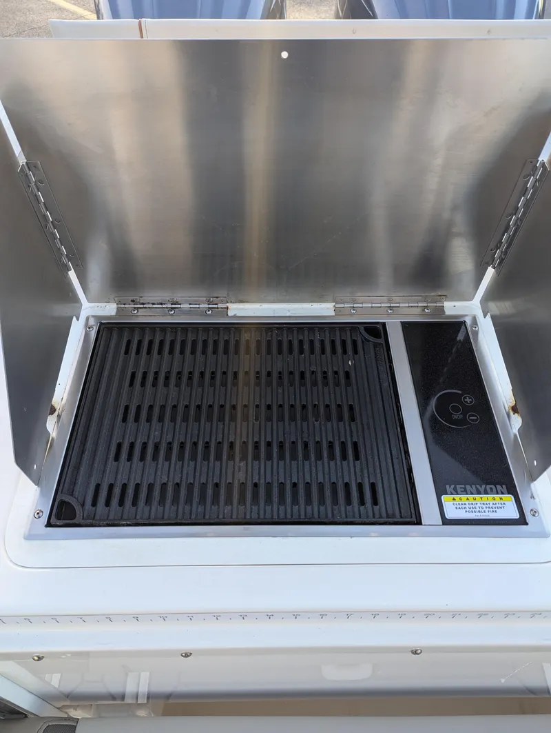Slide: The Image of 2022 Cutwater C-32 CB boat grill with stainless steel cover. - 19