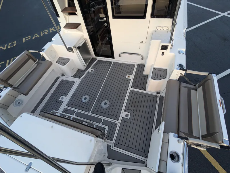 Slide: The Image of 2022 Cutwater C-32 CB boat deck with seating and storage compartments. - 23