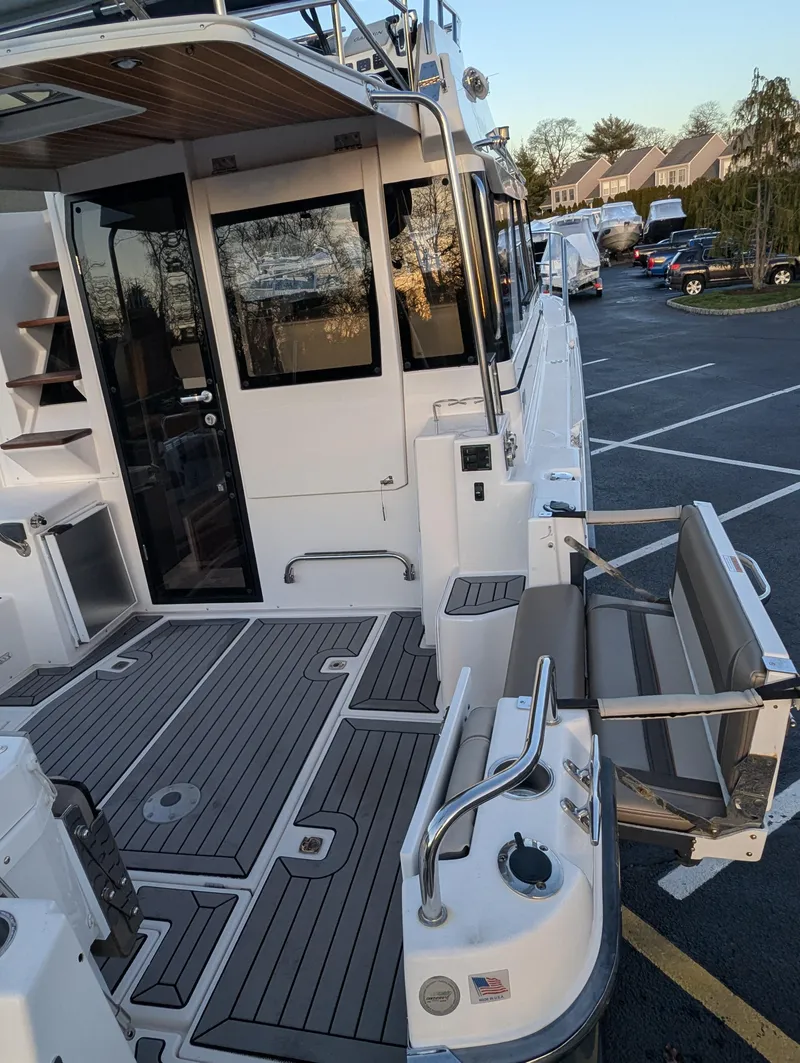 Slide: The Image of 2022 Cutwater C-32 CB boat deck with seating and modern design. - 24