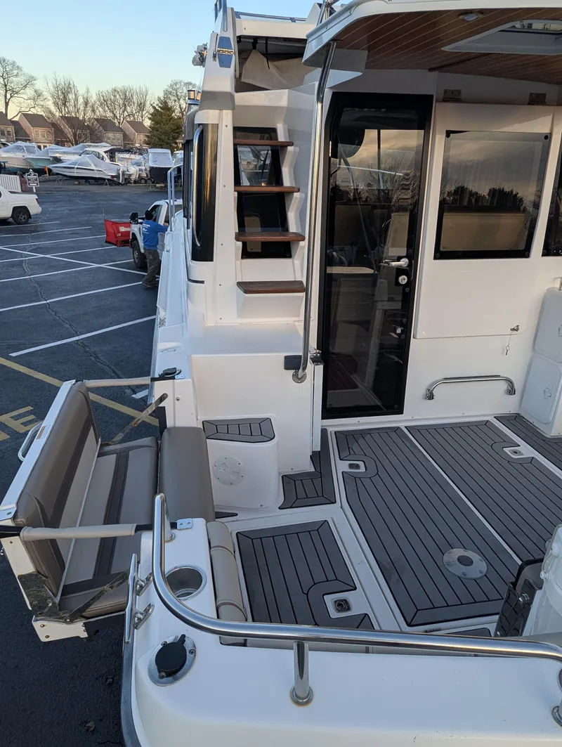 Slide: The Image of 2022 Cutwater C-32 CB boat with spacious deck and modern design. - 25