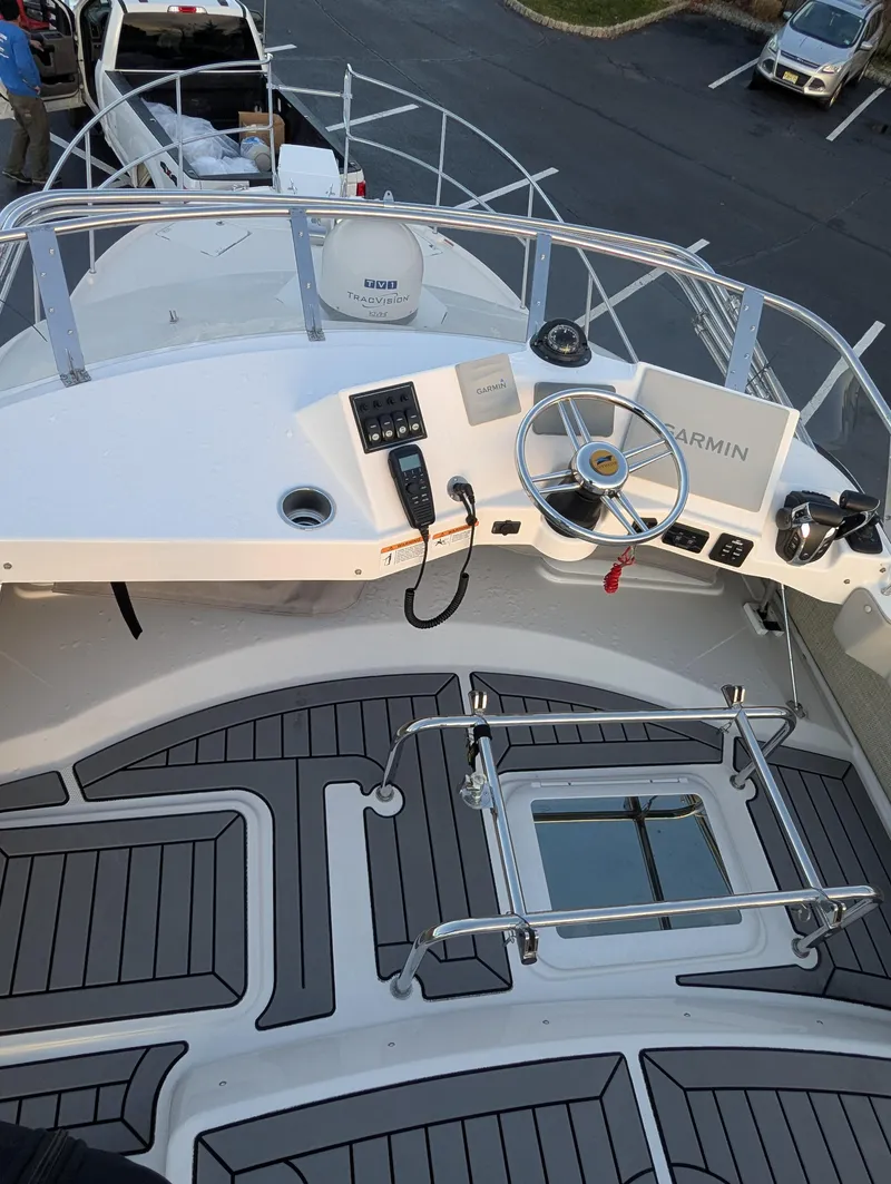 Slide: The Image of 2022 Cutwater C-32 CB boat helm with Garmin navigation system and modern controls. - 26