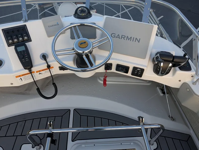Slide: The Image of 2022 Cutwater C-32 CB helm with Garmin navigation and control panel. - 28