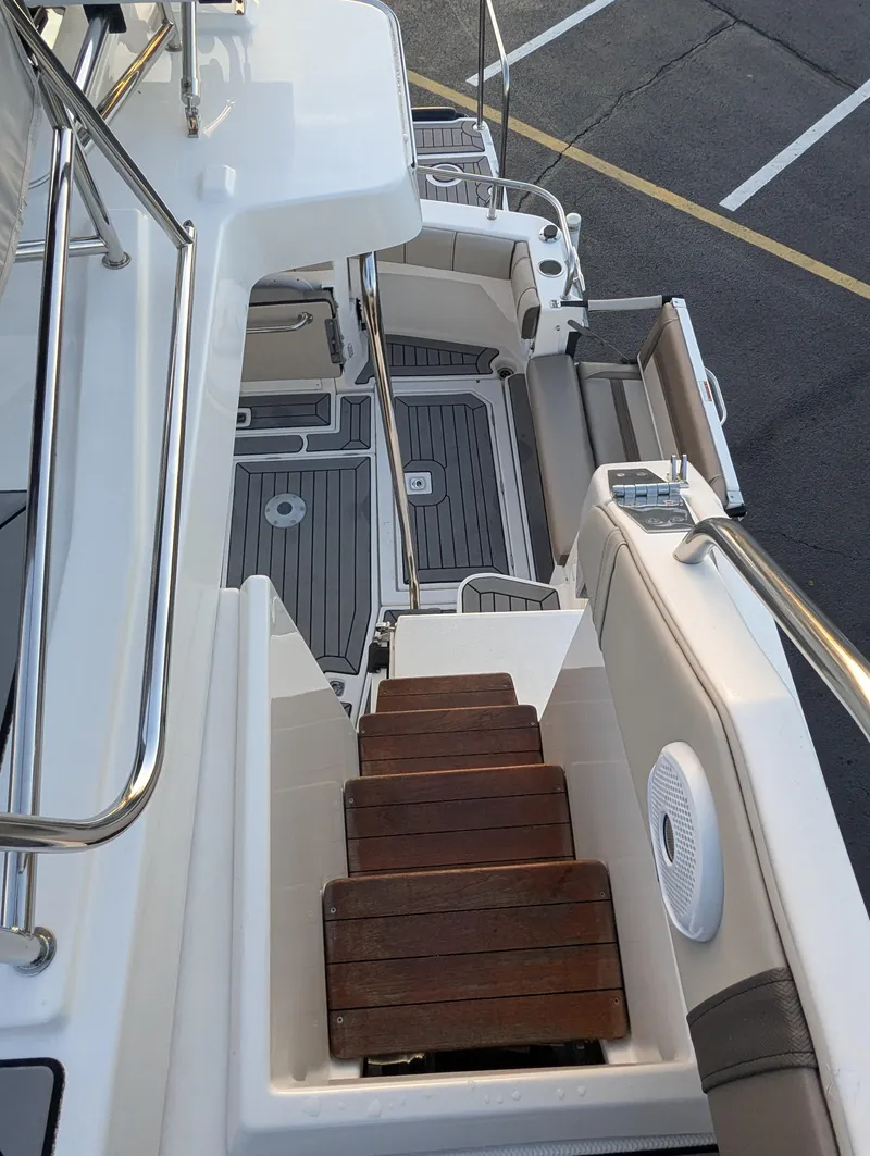 Slide: The Image of 2022 Cutwater C-32 CB yacht with wooden steps and sleek deck design. - 30
