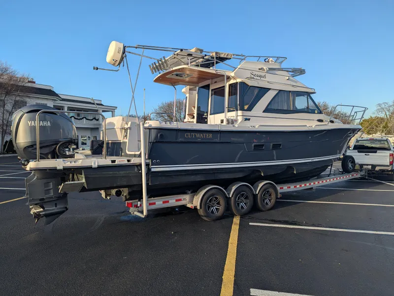 Slide: The Image of 2022 Cutwater C-32 CB boat on trailer in parking lot, side view. - 4