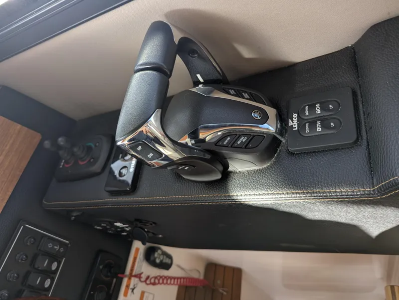 Slide: The Image of 2022 Cutwater C-32 CB boat controls with modern dashboard and throttle levers. - 44