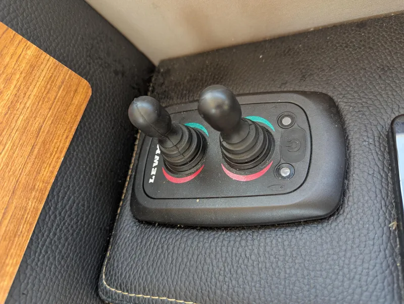 Slide: The Image of Lewmar joystick controls on 2022 Cutwater C-32 CB boat dashboard. - 45