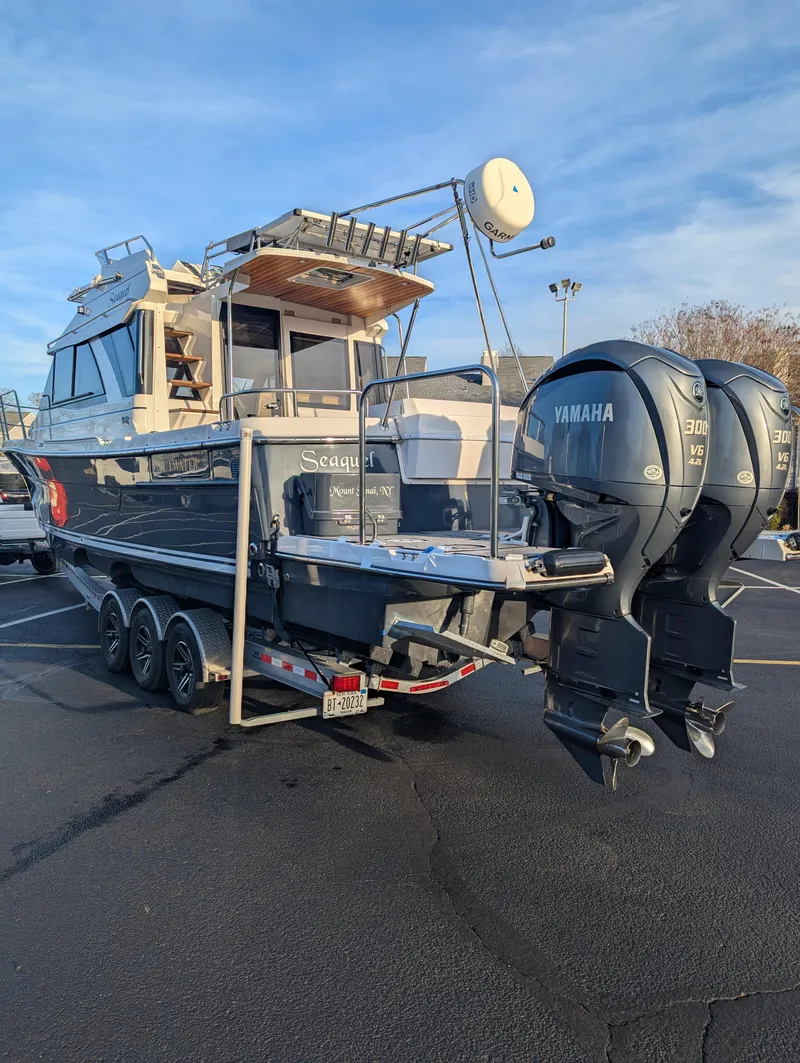 Slide: The Image of 2022 Cutwater C-32 CB boat with dual Yamaha engines on a trailer. - 7