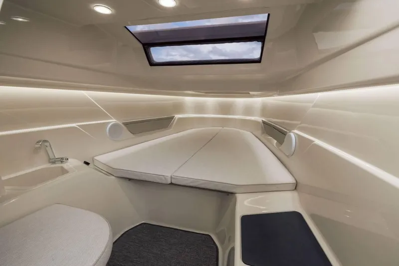 Slide: The Image of Luxurious interior cabin of 2025 Axopar AX/E 25 electric boat with skylight and modern design. - 15