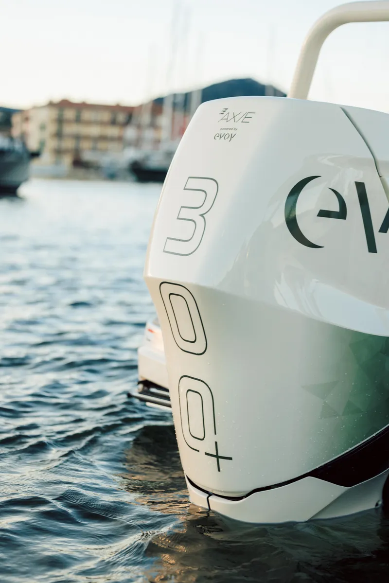Slide: The Image of 2025 Axopar AX/E 25 electric boat with EVOY® STORM engines on water. - 3