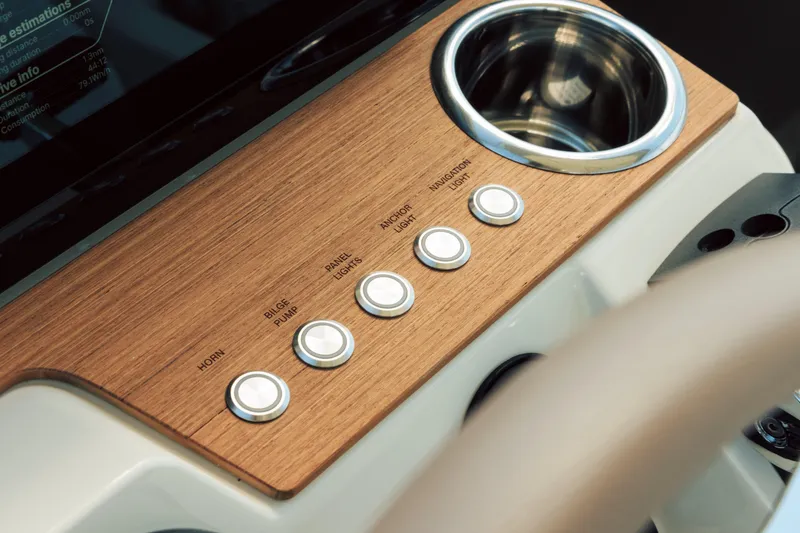 Slide: The Image of 2025 Axopar AX/E 25 electric boat with EVOY® STORM engines on open water. - 7