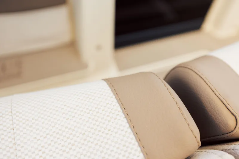 Slide: The Image of 2025 Axopar AX/E 25 electric boat with EVOY® STORM engines on open water. - 8