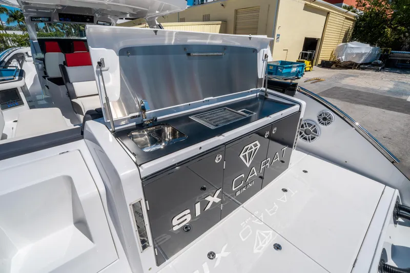 Slide: The Image of Outdoor kitchen on 2021 Cigarette 59 Tirranna yacht with sink and grill. - 16