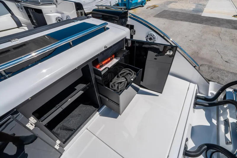 Slide: The Image of 2021 Cigarette 59 Tirranna boat storage compartments with ropes and equipment. - 18